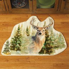 a deer is standing in the middle of a kitchen floor mat