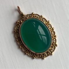 "A vintage 9 carat gold pendant displaying a green jadeite stone. A beautiful ornate design creates a lovely piece. CONDITION: Great condition, wear consistent with it's age and use. Please see photos for more detail. MARKED 9 CARAT GOLD  WEIGHT: 5.4 grams STONE (FACE): 19mm x 15mm STONE AND SETTING HEIGHT: 8mm ORNATE \"FRAME\": 4mm MEASUREMENT (DROP INC. LOOP): 34mm" Ornate Design, Turquoise Flowers, Ornate Frame, Antique Roses, Rose Cut Diamond, Flower Ring, Stone Pendant, Signet Ring, Stone Pendants