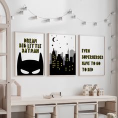 two posters on the wall in a child's room with batman and even super hero have to go to bed