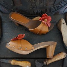 Woman Clogs with high heel in natural wood and Real Leather , handmade by Mario Doni. Woman Clogs Model: Chiara Clogs color: Leather * Heel: 70 mm Upper: Genuine leather Vegetable Color: Leather+ flower Red * On request also available in other colors Sabot made of wood in the best tradition of craftsmanship Tuscany. Uppers made of genuine leather Vegetable-available in a wide selection of colors to give joy to your Summer All our products are made exclusively to order, please contact me for furt Wooden Closed Toe Clogs With Wooden Heel, Closed Toe Mules With Wooden Heel, Wooden Heels With Leather Sole And Closed Toe, Wood Heels With Leather Sole And Closed Toe, Natural High Heels With Wooden Heel, Brown High Heel Clogs With Sculpted Heel, Leather Clogs With Wooden Heel In Natural Wood Color, Leather Mules With Wooden Heel In Natural Color, Wooden Clogs With Open Heel