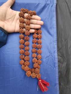 Rudraksha Origin:- Nepali Rudraksha (Premium Quality) 5 Face/Mukhi Rudraksha Pathri Mala (Premium quality) Beads - 54 + 1 Wearing Each beads Size - 19 - 20 MM (Apx.) Traditional Hand-strung Mala For Festivals, Mala With Latkans For Navratri Puja, Navratri Puja Mala With Latkans, Traditional Hand-strung Beaded Necklaces For Festivals, Traditional Beaded Necklaces For Rituals And Festivals, Traditional Beaded Necklaces With Round Beads For Festivals, Traditional Round Beaded Necklaces For Festivals, Traditional Multicolor Mala For Puja, Traditional Beads For Rituals And Festivals