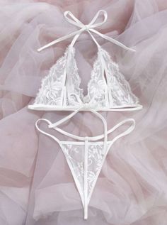 Indulge in luxury with our White Lingerie Set Mesh. Made with delicate lace, this set exudes elegance and sophistication. The mesh fabric adds a touch of sensuality, making you feel confident and alluring. Perfect for a special night or everyday wear. Elegant Lace Set For Wedding Night, Elegant Lace Bra For Wedding Night, Feminine String Bra With Delicate Lace, Elegant String Wedding Bra, Elegant Wedding String Bra, Elegant String Bra For Wedding, Lace Sheer Bra For Wedding, Lace String Bra For Party, Lace String Bra With Lace Closure