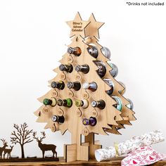 a wooden christmas tree with wine bottles in it