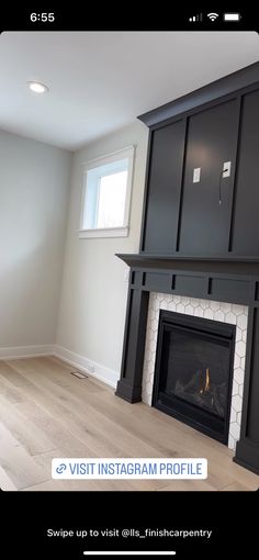 the fireplace is built into the wall in the living room, and it's surrounded by black cabinets