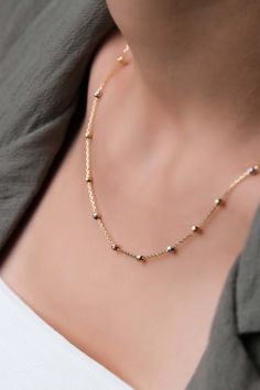 "This satellite chain necklace consists of gold, rose gold, and silver color small beads. The solid gold necklace made of tiny balls can be an elegant bridal shower gift. * Necklace length: Adjustable from 16,5\" to 17,7\" (Adjustable from 42 cm to 45 cm) * Temiroglu Gold products are real solid gold. It is definitely not gold plated, not gold filled. * All products are presented to you in high quality jewelry boxes. * Depending on your request, we can provide delivery in the form of a gift pack Necklace Real Gold, Gold Beaded Necklace, Real Gold Chains, Feminine Necklace, Elegant Bridal Shower, Solid Gold Necklace, Small Beads, Rosary Necklace, Gold Bead Necklace