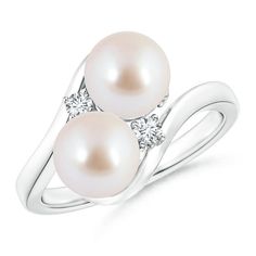 Two Akoya cultured pearls are gracefully placed in between a bypass shank symbolizing togetherness between two souls. The prong set diamond accents look dainty with the pair of pearls and give a hint of sparkle to the ring. This femininely styled pearl bypass ring is in silver. Akoya Pearl Ring, Cultured Pearl Ring, Pearl Rings, Bypass Ring, Ring With Diamond, Akoya Pearls, Pearl Ring, Cultured Pearls, Prong Setting