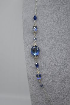 Necklace measures 27 inches long and features sapphire blue Austrian crystal beads. Chain is stainless steel as well the clasp. It can be dressed up or down and adds a fun pop of color and sparkle to your outfit! The length would be perfect to pair with a high collar shirt or sweater, not too long or too short. Find my shop here: https://www.etsy.com/shop/rhinestonerain?ref=seller-platform-mcnav Other necklaces like this one here: https://www.etsy.com/shop/rhinestonerain?ref=seller-platform-mcna Elegant Blue Long Chain Necklace, Elegant Long Blue Chain Necklace, Blue Metal Crystal Necklaces For Jewelry Making, Blue Crystal Necklaces For Jewelry Making, Elegant Blue Jewelry With Beaded Chain, Elegant Blue Beaded Chain Jewelry, Elegant Glass Necklaces With Lobster Clasp, Elegant Glass Wire Wrapped Necklaces, Elegant Blue Glass Necklaces