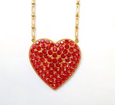 Giant heart chain gold red rhinestone necklace heart rhinestone heart red large statement red valentine made in Germany The necklace shown is handmade in Germany. The metal is tombac, gold galvanized. The stones used are 6mm Swarovski® crystals in red. Size: pendant approx. 7.3 x 7 cm Length: chain length approx. 75 cm Color: Red Gold Red Valentine, Heart Rhinestone, Heart Red, Heart Chain, Necklace Heart, Rhinestone Heart, Red Rhinestone, Chain Gold, Rhinestone Necklace