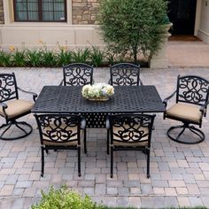 an outdoor dining table with six chairs