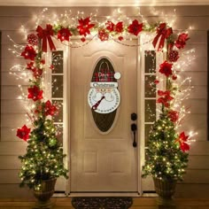 the front door decorated with christmas lights and decorations