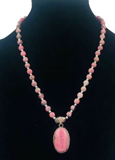 Sterling Silver pink Rhodochrosite pendant Faceted Bead Necklace Artisan. Measures approximately 24" long Excellent preowned Condition Will ship in gift box Thanks for looking! Pink Hand-strung Round Bead Necklaces, Pink Hand-strung Round Beads Necklace, Bohemian Pink Agate Necklace, Pink Agate Beaded Necklaces With Round Beads, Pink Agate Beaded Necklace With Round Beads, Pink Opal Gemstone Pendant Necklace, Pink Faceted Beads Necklace For Healing, Pink Healing Faceted Bead Necklaces, Healing Pink Faceted Bead Necklaces