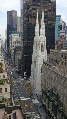 an aerial view of a city with tall buildings