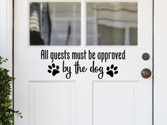 a door with the words, all guests must be approved by the dog on it