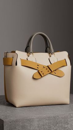 A belted tote influenced by our iconic trench, panelled inside and out in supple tri-tone leathers. Leather Bag For Everyday Luxury, Beige Bags With Leather Handles For Everyday Luxury, Everyday Luxury Beige Bags With Leather Handles, Luxury Tote Bags, Sacs Design, Bowling Bags, Leather Belt Bag, Burberry Handbags, Waist Bags