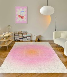 a living room filled with furniture and a pink rug