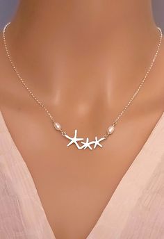 Look as elegant and chic with our Sterling Silver Starfish Necklace with tiny freshwater pearls accent.   DETAILS * Starfish is sterling silver, 32x14mm * Chain is Sterling Silver  Italian Rollo * Crafted in my home studio in Maine * Will be in a gift box ready for gift giving LENGTHs * Available in 14", 16", 18", 20"  * 2 inches extender with be included and attached »Shop for more STYLES @ http://www.femmartjewelry.etsy.com Get SOCIAL with me: * Instagram: @FemmartJewelry * Pinterest: https:// Ocean-inspired Silver Jewelry For Wedding, Ocean-inspired Sterling Silver Jewelry For Wedding, Ocean-inspired Sterling Silver Jewelry For Weddings, Silver Star-shaped Pearl Jewelry, Star-shaped Silver Pearl Jewelry, Silver Pearl Chain Jewelry For Beach, Elegant Starfish Charm Jewelry For Anniversary, Elegant Silver Starfish Necklace, Elegant Silver Jewelry For Beach Wedding