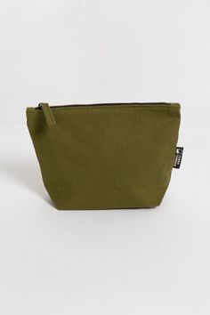 If you’ve been looking for an eco-friendly makeup bag to tame and organize cosmetic items, consider the simple and affordable Lok Pouch. Your purchase also supports Feeding America's campaign to end hunger by helping donate meals to kids and families in need. Size:  7"(H) x 9"(W) x 3"(D) Opening: 7 inches Made with 14-oz Certified Fairtrade Organic cotton canvas Long pull zipper YKK lead-free antique finish metal zippers All the accessories including zippers and fasteners are lead-free Made in a Green Functional Cosmetic Bag For Everyday Use, Functional Green Cosmetic Bag For Daily Use, Eco-friendly Pouch Cosmetic Bag For Daily Use, Everyday Green Pouch Cosmetic Bag, Green Everyday Pouch Cosmetic Bag, Eco-friendly Cosmetic Bag With Zipper For Daily Use, Eco-friendly Everyday Cosmetic Pouch Bag, Everyday Green Zipper Pouch Cosmetic Bag, Eco Friendly Makeup