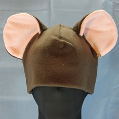 a brown hat with ears on top of it