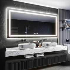 a bathroom with two sinks and a large mirror above the sink in front of it