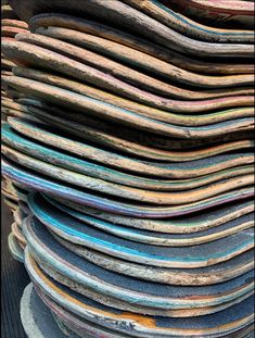 a stack of newspapers sitting on top of each other in front of a pile of chairs