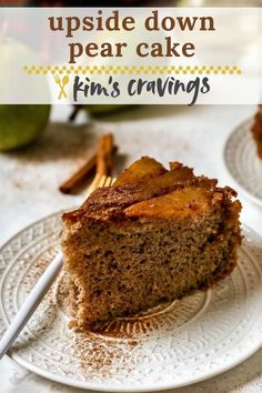 a close up of a piece of cake on a plate with the words, upside down pear cake x finn's crumbs