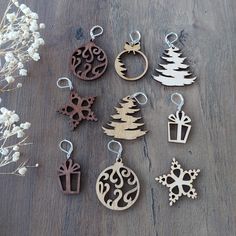 wooden christmas ornaments are sitting on a table