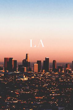 an aerial view of the los angeles skyline at sunset