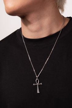 This Stainless Steel Chain Necklace with Ankh Pendant is the perfect blend of style and ancient symbolism. The Ankh pendant, an ancient Egyptian symbol of life, adds a touch of spirituality and cultural significance to this necklace. Whether you're looking to make a fashion statement or simply want to add a meaningful accessory to your collection, this necklace is a great choice. Plus, with its affordable price and versatile design, it makes a great gift for any friend or loved one. Size Length: Cheap Ankh-shaped Spiritual Necklaces, Ankh Necklace Men, Symbolic Metal Chain Necklace, Symbolic Stainless Steel Necklace With Large Pendant, Spiritual Stainless Steel Necklaces With Large Pendant, Spiritual Stainless Steel Necklace With Large Pendant, Symbolic Cross Pendant Necklaces, Spiritual Metal Pendant Chain Necklace, Spiritual Pendant Metal Chain Necklace