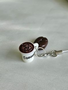 a keychain with a coffee cup on it