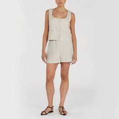 The Linen Top and Shorts offer breezy comfort and effortless style for casual outings. Crafted from lightweight linen fabric, the top features a relaxed fit with a flattering smock detail, while the coordinating shorts provide a comfortable and chic option for warm-weather relaxation. Explore the epitome of refined fashion with this must-have piece. DETAILS - Front button cropped. - High-waisted. - Invisible zip closure at the font. 🍀One set includes ONE TOP and ONE Shorts. If you want to buy t Chic Short Length Tank Top For Summer, Chic Short-length Summer Tank Top, Chic Short Length Summer Tank Top, Summer Loungewear Tank Top In Short Length, Versatile Tank Top For Summer Loungewear, Summer Loungewear Tank Top Short Length, Summer Short Tank Top For Day Out, Sleeveless Linen Tank Top For Daywear, Spring Loungewear Tank Top Short Length