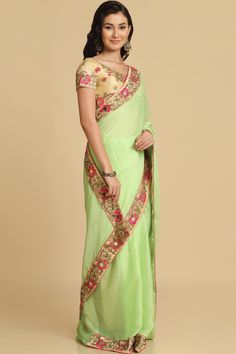 Product Features: Saree: Saree as seen in picture - Choose the drape style while order: Standard, Pleated or Gujarati Saree Fabric: Chiffon Saree Color: Lime Saree Work: Woven Saree Border And Pallu: Lace Border And Fancy Pallu Blouse: Blouse Design Must Be Chosen While Ordering. For The Blouse In Pic, Please Choose The Selection "As Seen In Picture" Or Customize Your Selection Blouse Fabric: Dupion Silk Blouse Color: Cream Blouse Work: Woven Wash: Dry Clean Occasion: Party Disclaimer: There Wil Pista Green Chanderi Blouse Piece For Reception, Embroidered Pista Green Pre-draped Saree For Reception, Art Silk Saree For Reception During Navratri, Pista Green Pre-draped Saree With Zari Work For Diwali, Green Embroidered Pre-draped Saree, Pista Green Georgette Pre-draped Saree With Dupatta, Transitional Green Saree With Resham Embroidery, Transitional Season Green Saree With Resham Embroidery, Transitional Georgette Traditional Wear With Mirror Work