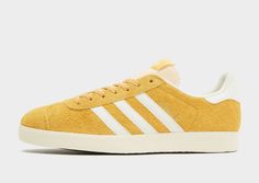 Freshen up your 'fits with these men's Gazelle trainers from adidas Originals. Inspired by heritage style and honouring their beloved 1991 version, they land in a Preloved Yellow colourway. They feature a premium suede upper that offers a soft feel with each step, and have a nylon tongue and lace fastening to lock things in. Sitting on a grippy gum rubber sole, they're signed off with Trefoil logos, serrated 3-Stripes and Gold-foil Gazelle branding. | IF9654 Yellow Adidas, Adidas Originals Gazelle, Heritage Fashion, Adidas Gazelle, Jd Sports, Black Adidas, Gold Foil, Adidas Originals, Rubber Sole