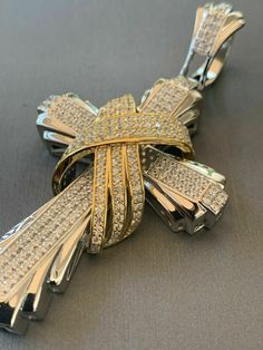 "Men's Custom Made Super Iced Out HEAVY Cross Pendant! Solid 925 sterling silver We have 3 styles! Rhodium finished, two-toned, & 14k yellow gold finished! Color lasts many years!! Measures roughly 2.5\" by 1.5\" ..weighs roughly 25 grams 200 micropaved handset simulated diamonds (CZ) for a total of 3ct! 100% 925 silver...not plated or filled...will NEVER TARNISH OR CHANGE COLOR LISTING IS FOR PENDANT ONLY, CHAIN NOT INCLUDED Bale fits most chains up to 8mm thick!" White Gold Polished Cross Jewelry, Luxury Diamond Cut Cross Jewelry, White Gold Cross Jewelry With Polished Finish, Luxury Cross-shaped Diamond Cut Jewelry, Luxury Cross Pendant Jewelry With Polished Finish, White Gold Diamond Jewelry With Shiny Finish, Silver Cross Jewelry With 17 Jewels, Luxury Silver Cross Jewelry, Diamond Cross Pendant Jewelry With Polished Finish