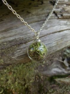 This teeny tiny round glass pendant is filled with real moss! Take a piece of the forest everywhere with you. The ball is about half an inch across. The moss is preserved so it will stay green and lush.  It comes on a nickel- free silver chain with a lobster clasp. Goblincore Necklace, Therian Clothes, Trinket Trading, Moss Crafts, Goblincore Jewelry, Moss Jewelry, Moss Necklace, Forest Jewelry, Forest Necklace