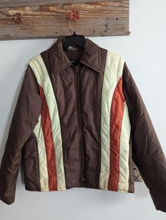 Vintage Vanderbilt Ski Jacket. In fantastic condition for age and use. Sleeves zip off and this converts into a vest. All zippers work. No rips or tears. May be some very light marks from use as this is a vintage item.  Chest: 20 inches  Sleeves: 25 inches  Shoulder to hem: 26 inches Vintage Brown Outerwear With Zip Fly, Vintage Brown Outerwear With Zipper Closure, Retro Brown Outerwear With Zipper Closure, Retro Brown Outerwear For Cold Weather, Vintage Outerwear With Ykk Zipper For Fall, Vintage Outerwear With Zip Fly For Fall, Vintage Fall Outerwear With Zip Fly, Vintage Windbreaker For Cold Weather In Fall, Vintage Ski Jacket