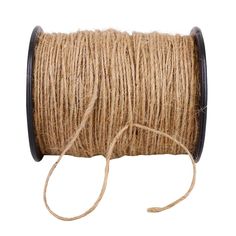 a spool of twine on a white background