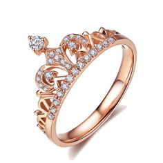 a rose gold crown ring with diamonds on the bottom and an inscription that reads, umode