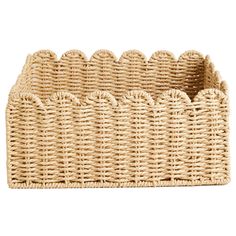 a wicker basket with handles on white background