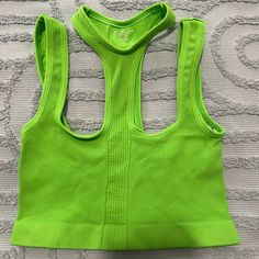 Keep Things Interesting In This Bright Green Cropped Top With Neck Strap Detail. Never Worn. Good Condition, Uo Sporty Green Crop Top For Spring, Trendy Green Tank Top For Sports, Green Summer Crop Top For Workout, Green Summer Workout Crop Top, Summer Green Workout Crop Top, Urban Outfitters Green Spring Tank Top, Green Urban Outfitters Tank Top For Spring, Urban Outfitters Green Tank Top For Spring, Green Fitted Racerback Crop Top