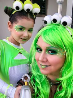 two girls with green hair and monster makeup