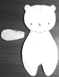 a black and white photo of a teddy bear