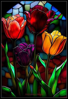 three colorful flowers in front of a stained glass window