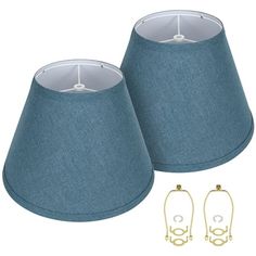 two blue lamps are next to each other on a white background with gold hardware and earring clips