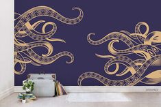 an artistic wall mural with gold swirls on a blue background, in the corner of a room