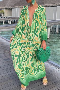 Green Abstract Button Chest Oversized Long Sleeve Dress Look perfect in any setting wearing this flowing playful maxi dress.Easy to dress up with espadrille heel sandals or down with ballet flats.Notched V-neckline with button extension.Baloon long-sleeves with elasticized hem.Lightweight and breathable gives to functionality that it will be easy to wear as a caftan resort wear style, go belted for a elegant summer dinner date or wear like a moomoo around the house.Very versatile staple piece! D Balloon Sleeve Dress, Loose Maxi Dress, Dress Women Elegant, Ankle Length Dress, Dress Shirt Sleeves, Vestidos Vintage, Floral Print Maxi, Womens Casual, Maxi Dresses Casual