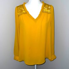 Nwot Loft Gold Mustard Long Sleeve Lace Ruffle Blouse Top L 100% Polyester Pit To Pit 20” Smoke Free And Pet Free Home Elegant Yellow V-neck Top, Yellow V-neck Top For Party, Elegant Yellow Tops For Fall, Elegant Yellow V-neck Blouse, Yellow V-neck Blouse For Fall, Yellow Long Sleeve Blouse With Ruffles, Yellow Ruffled Long Sleeve Tops, Yellow Ruffled Long Sleeve Blouse, Yellow V-neck Ruffle Blouse