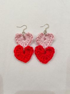 "These cute & flirty dangle heart earrings are the perfect accessory for Valentine's Day or a statement piece for everyday wear.  DETAILS: This item is handmade  Materials: Acrylic Yarn, iron ear hooks Size: approx. L 3\" x W 1.5\"  📦 Free Shipping on US orders of $35+ ❤️ If you have any questions, please feel free to send me a message ❤️ Follow us on Instagram & TikTok @tintin_designco for store updates and discounts PLEASE NOTE THAT DUE TO THE HANDMADE NATURE OF THESE ITEMS, WE DO NOT ACCEPT RETURNS. HOWEVER, IF THERE IS A PROBLEM WITH YOUR ORDER, PLEASE MESSAGE ME." Trendy Dangle Heart Earrings For Valentine's Day, Handmade Heart Drop Earrings For Valentine's Day, Handmade Drop Earrings For Valentine's Day, Trendy Red Dangle Heart Earrings, Handmade Dangle Heart Earrings For Valentine's Day, Handmade Heart-shaped Trendy Earrings, Valentine's Day Multicolor Dangle Heart Earrings, Handmade Red Heart Earrings For Valentine's Day, Red Dangle Heart Earrings For Valentine's Day