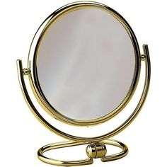 a mirror that is on top of a metal stand with an oval mirror in the middle