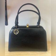 Stunning Vintage Coblentz Ladies Bag. Demure And Sophisticated In Detail And Size. Textured High Sheen Leather In Beautiful Condition With Gold Tone Brass Hardware And Satin Interior. This Is The Finishing Touch To The Crisp Look Of Suited Ladies In The 1950’s. Elegant Enough For A Nice Dinner, Or Cocktail Hour But Universal Enough For Work. Questions Welcome, Measurements Coming. Elegant Handheld Leather Evening Bag, Elegant Evening Bag With Handle Drop For Office, Handheld Leather Evening Bag For Formal Occasions, Handheld Leather Evening Bag For Formal Events, Elegant Leather Satchel For Formal Occasions, Elegant Business Shoulder Bag With Handle Drop, Formal Handheld Leather Evening Bag, Elegant Everyday Satchel Evening Bag, Elegant Evening Satchel