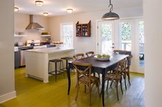 a kitchen and dining room with an open floor plan